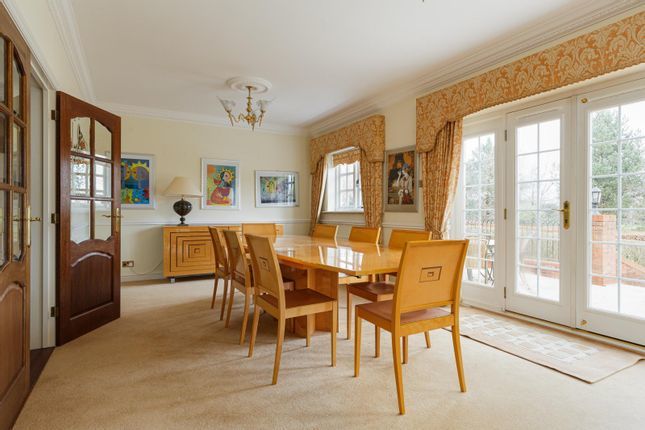 The dining room has doors leading onto the garden