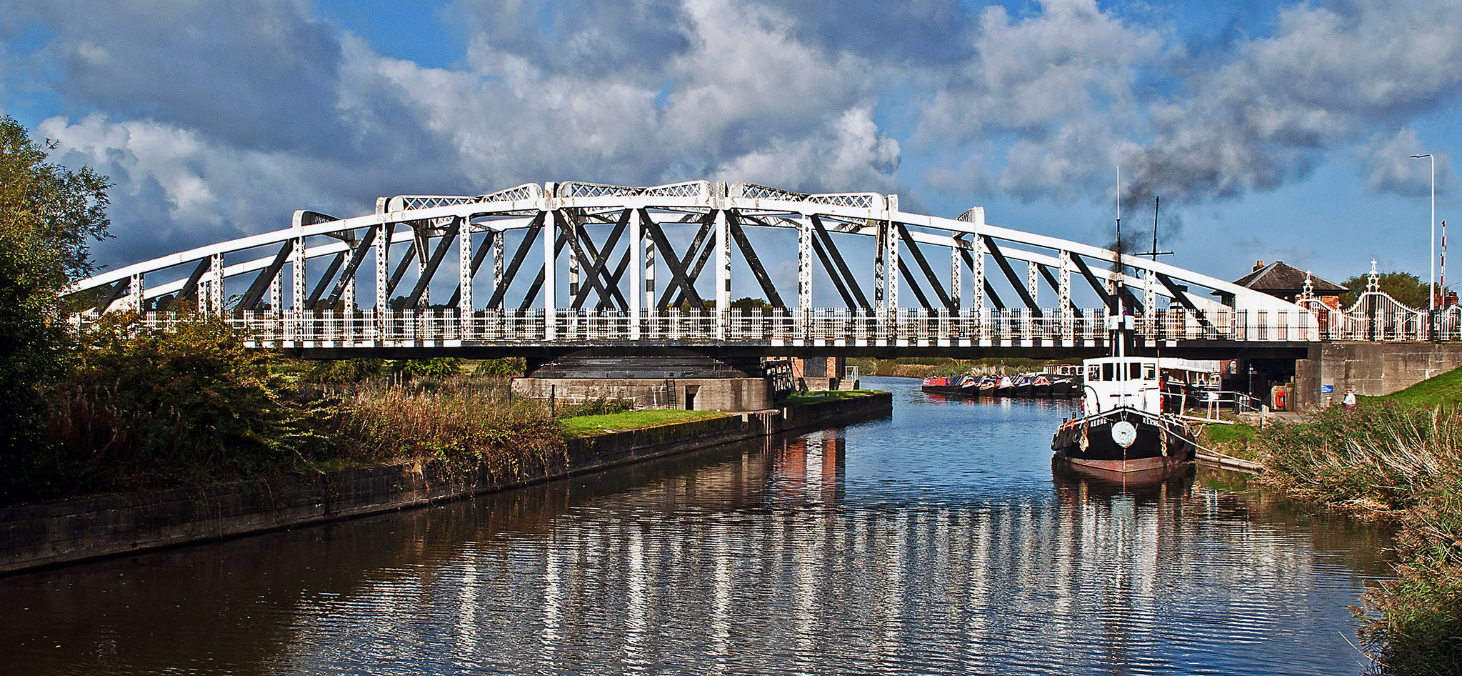 Acton Bridge under cloudy skies by Joy Beresford