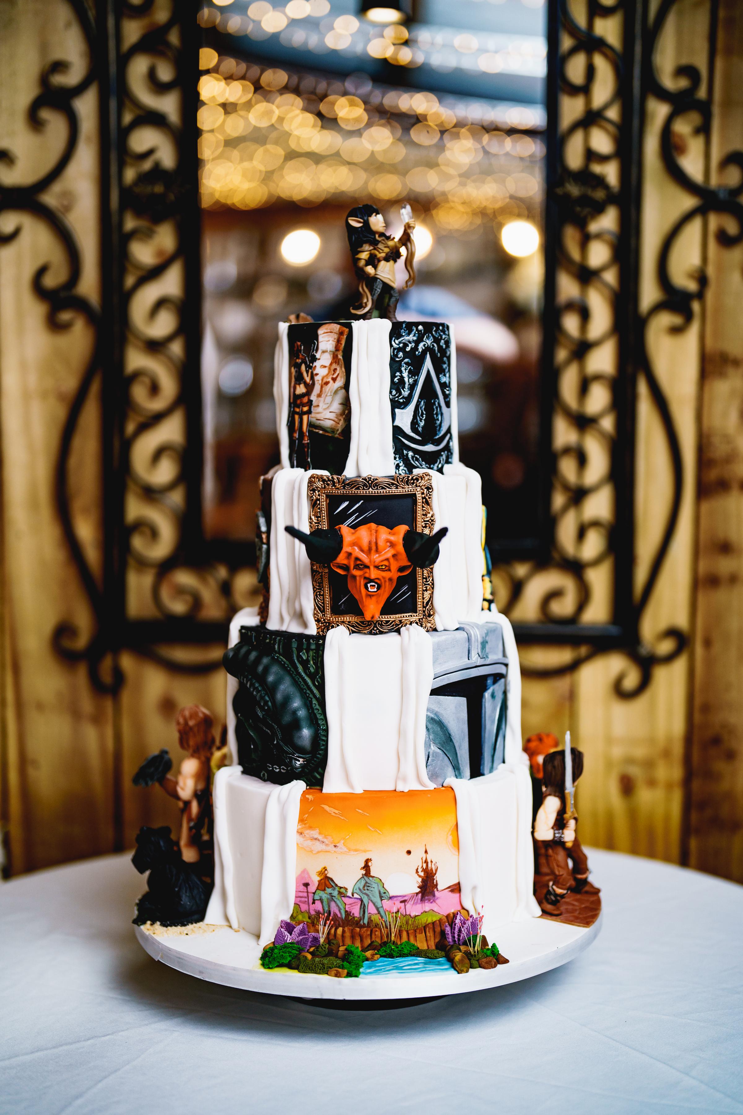 Each tier of the wedding cake featured four iconic visuals from some of the couples favourite movies, games and TV shows